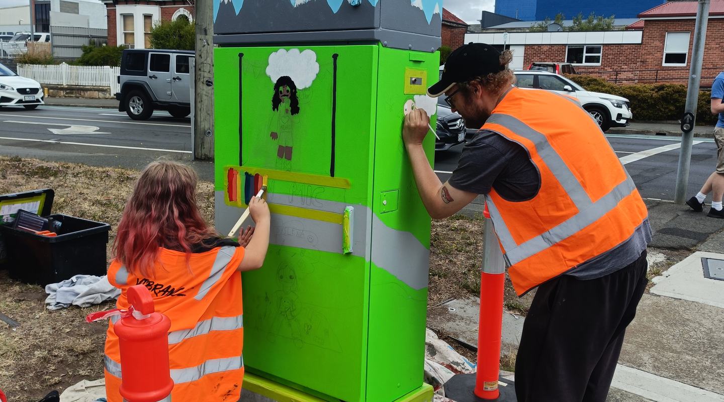 Artist Yolanda Mycak-Machin working on her signal box with guardian