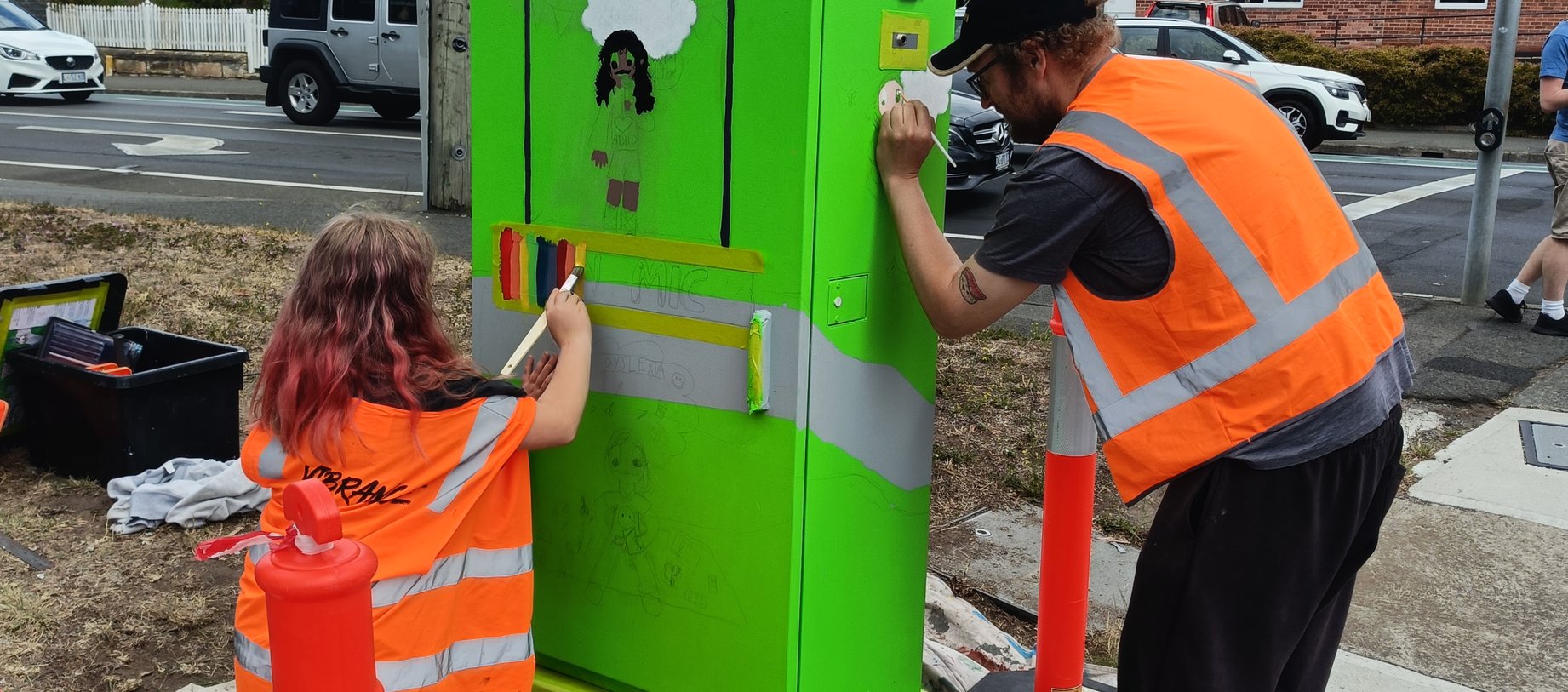 Artist Yolanda Mycak-Machin working on her signal box with guardian