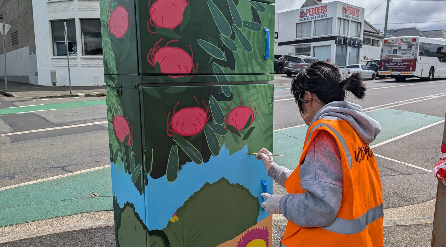 Yuexin Wang painting their signal box
